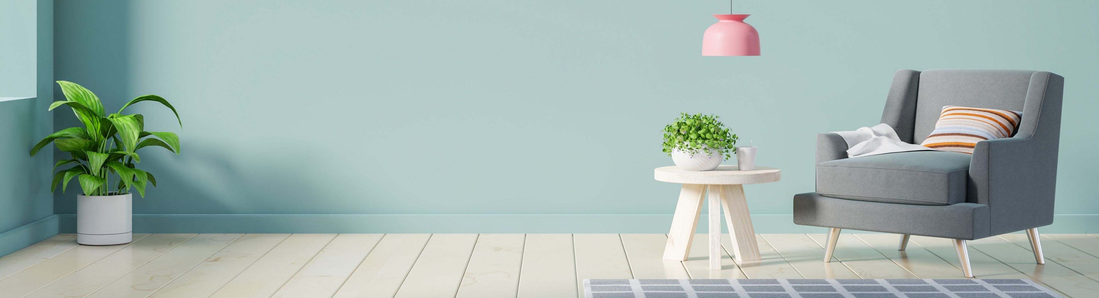 Picture of a room with a single grey chair, side table, lamp, with a nice wood floor